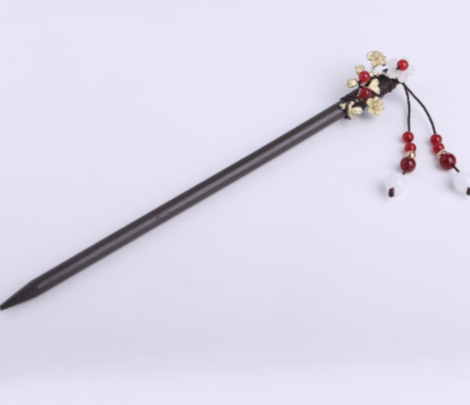 Decorative hair stick with beads on a white background