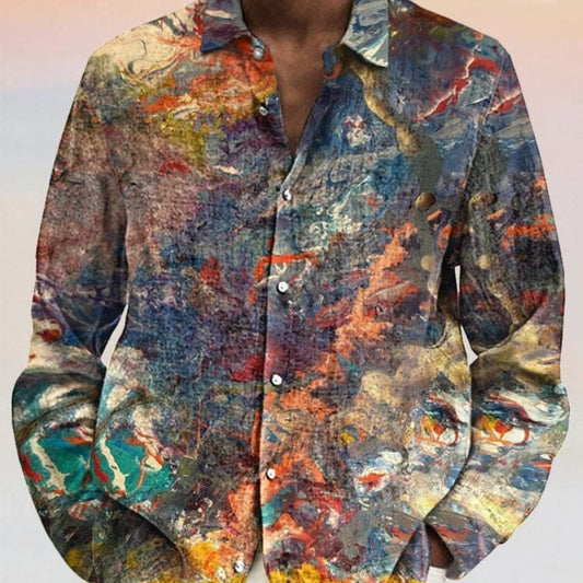 A men's casual beach shirt with a multicolored, abstract paint splatter design.