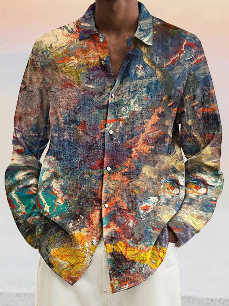 A men's casual beach shirt with a multicolored, abstract paint splatter design.