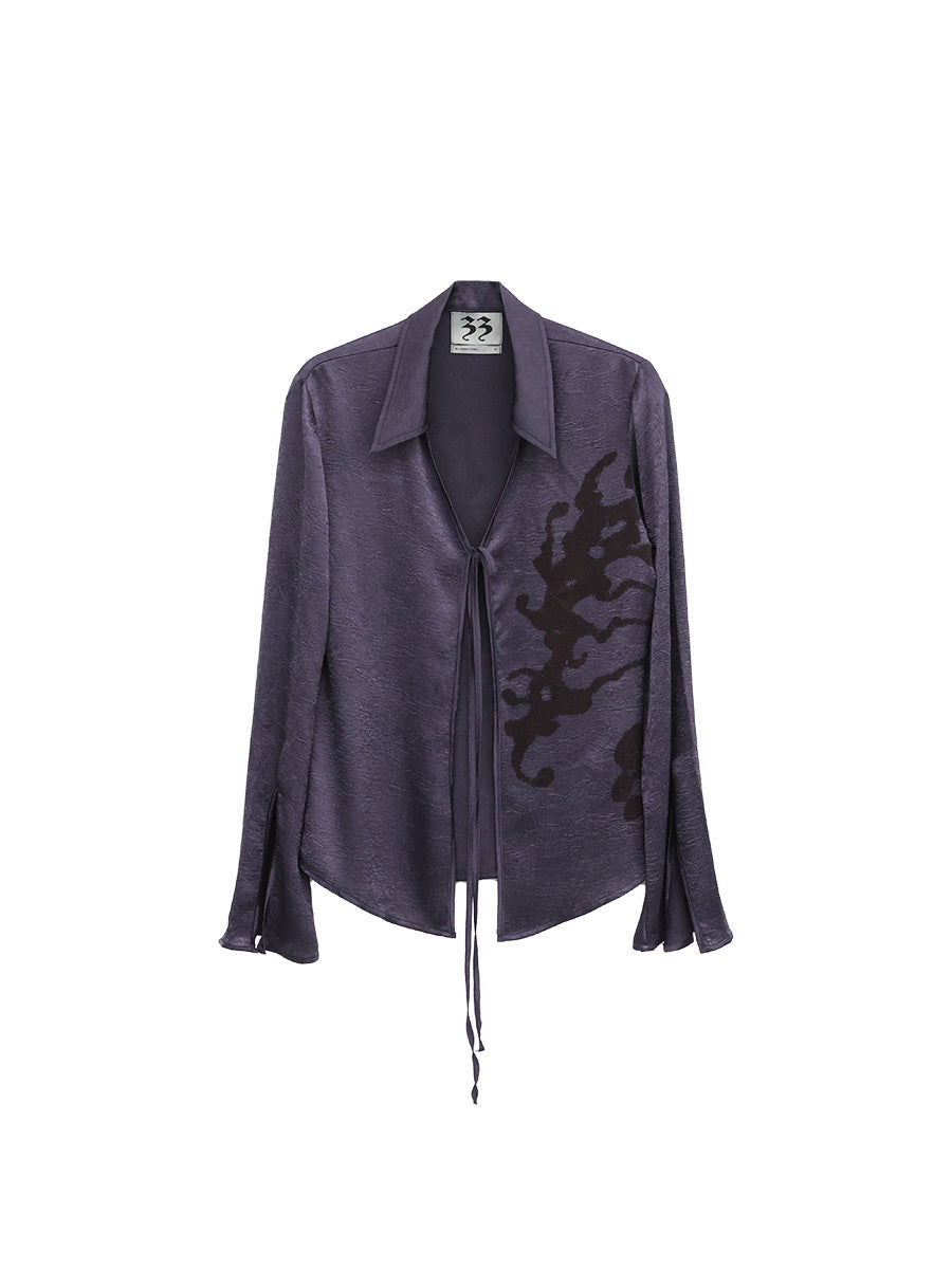 Purple jacket with black design on a white background