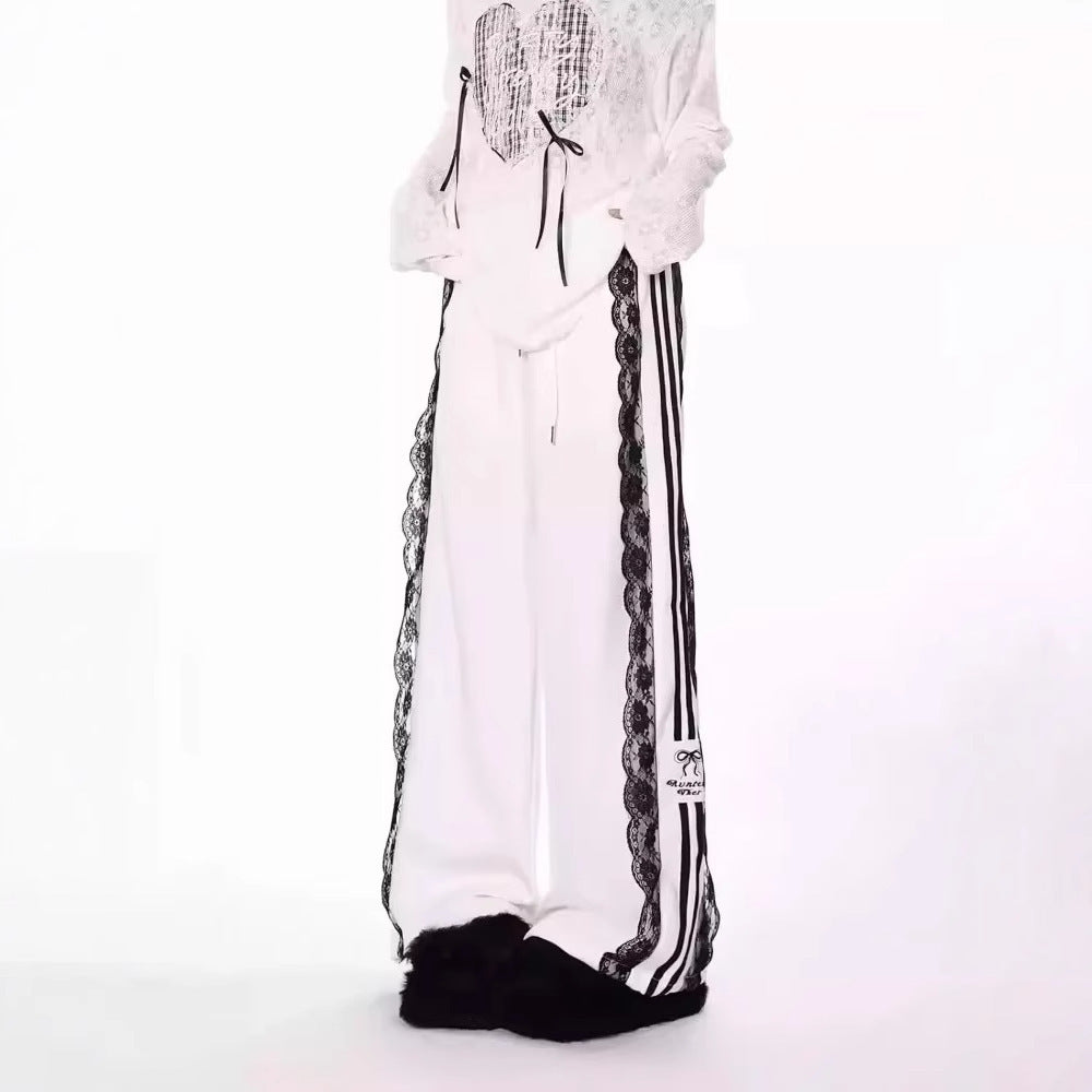White pants with black and white stripes on a white background