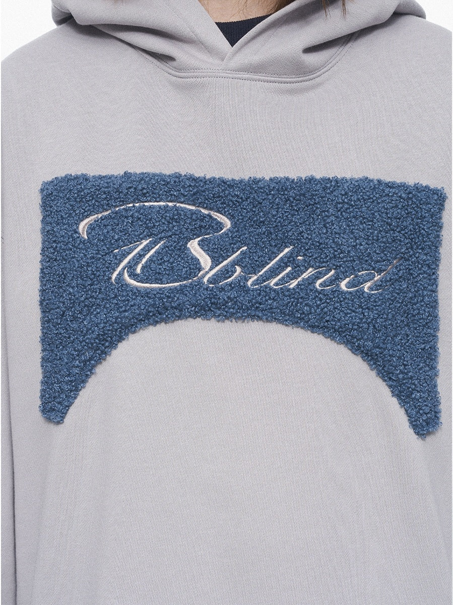 Gray hoodie with blue textured patch and 'BBlind' branding