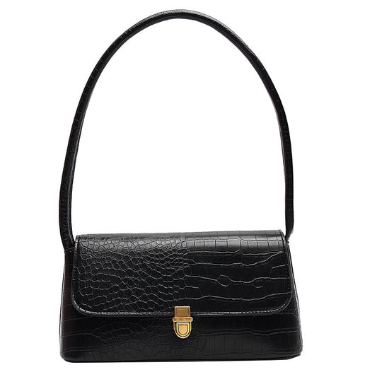 Black handbag with a gold clasp on a white background