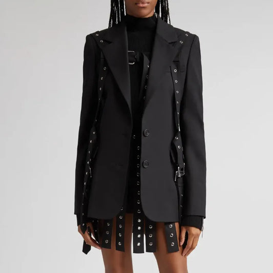 Black trench coat with decorative elements on a plain background