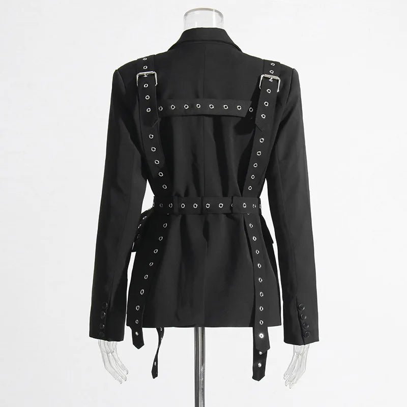 Black jacket with silver studs and a belt on a mannequin against a white background