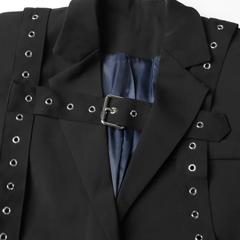 Black jacket with silver eyelet details and a blue lining