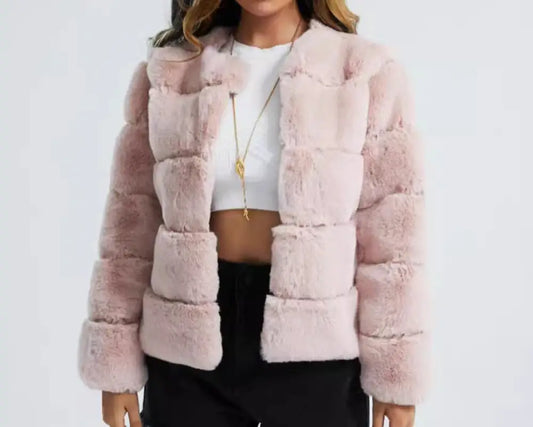 Woman wearing a pink faux fur jacket on a white background