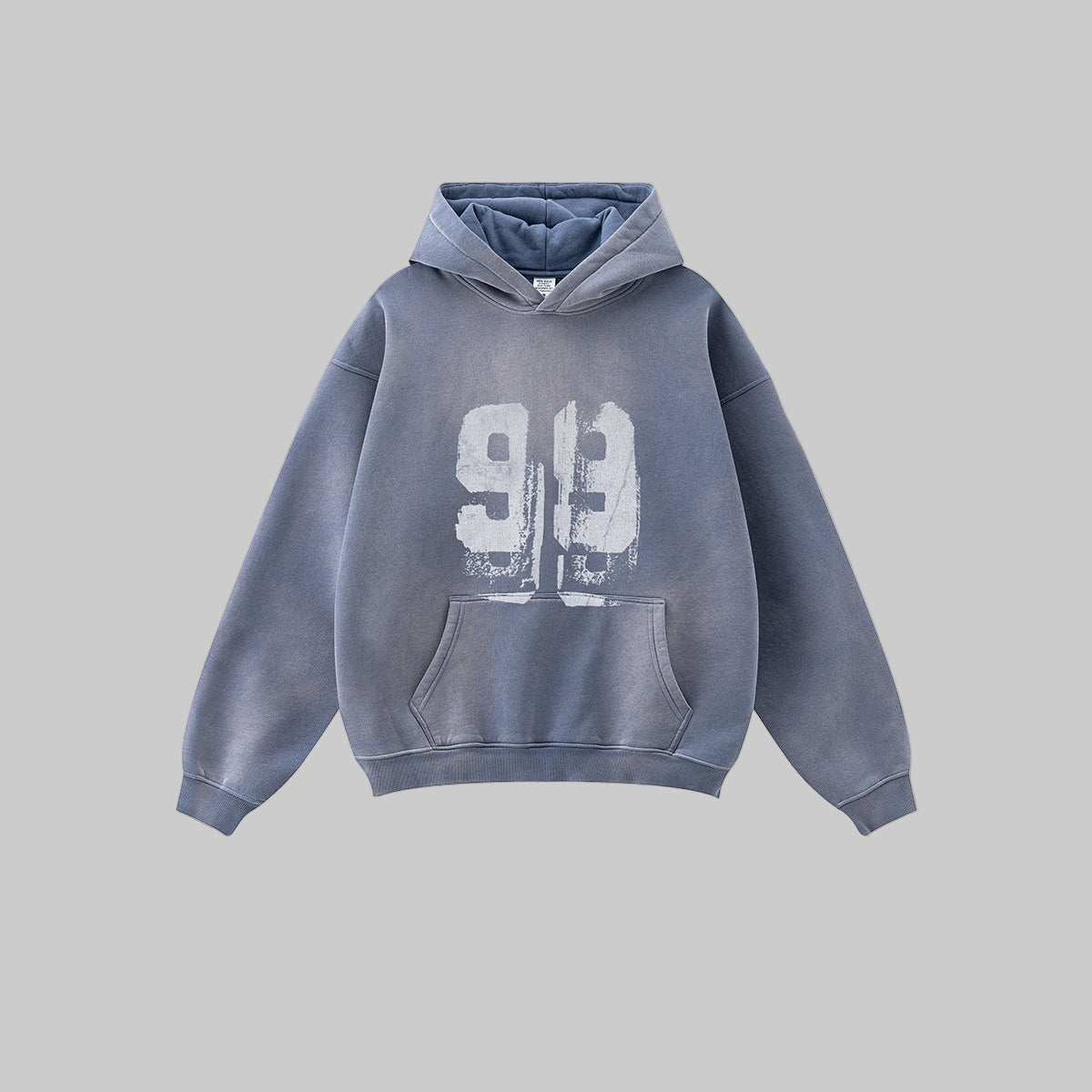 Blue hoodie with graphic design on a beige background
