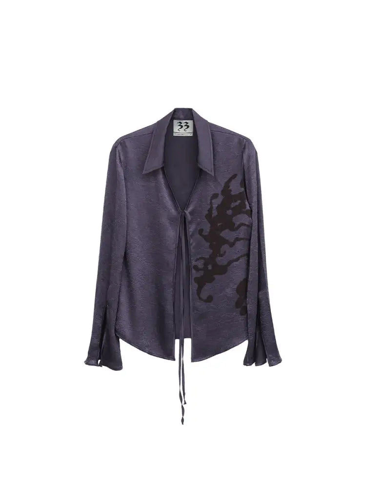 Purple jacket with black design on a white background
