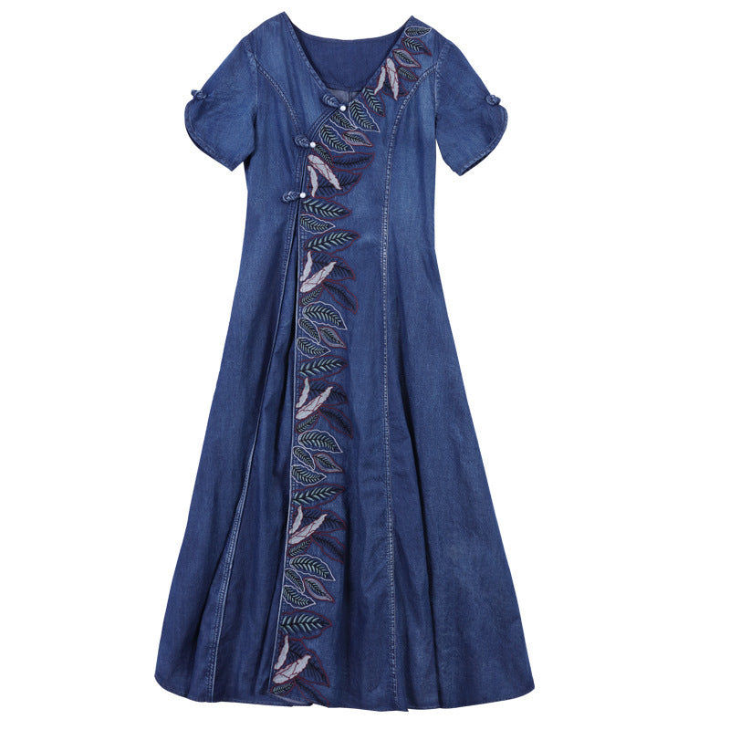 Blue denim dress with embroidery on a white background