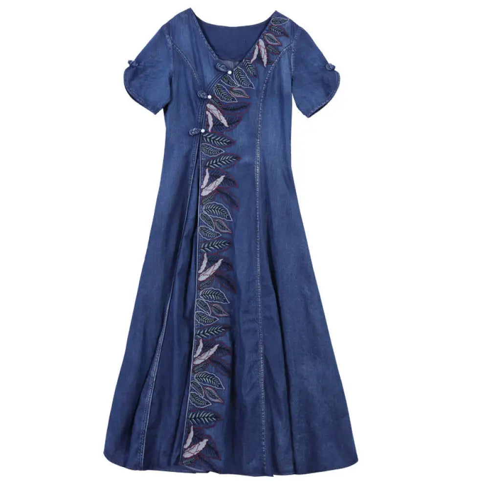 Blue denim dress with embroidery on a white background