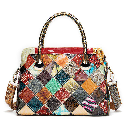 Multicolored patchwork handbag with textured patterns on a white background