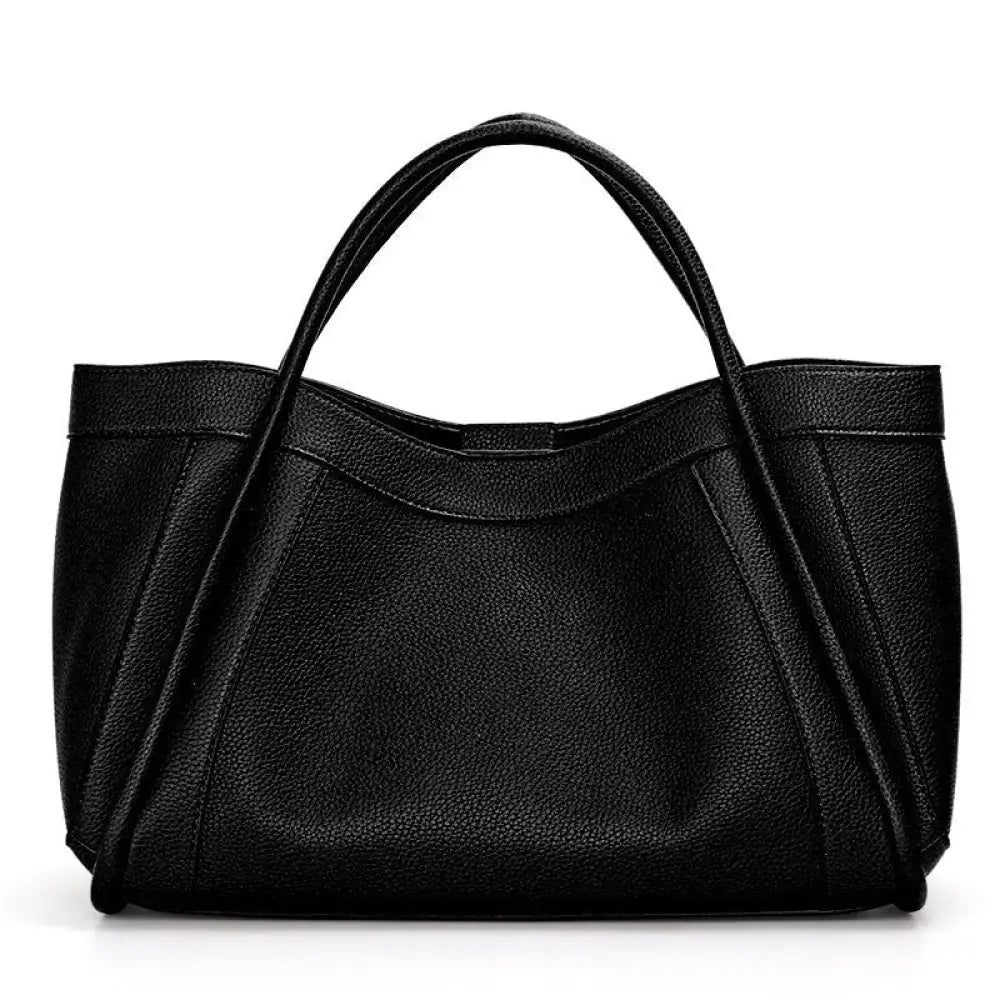 Black leather handbag on a white background
