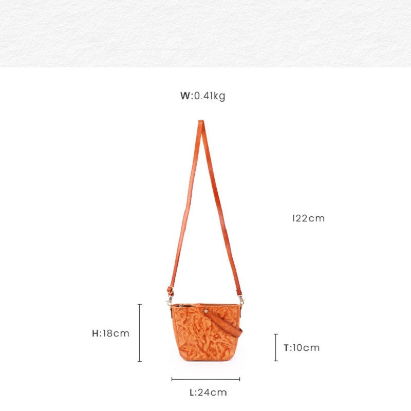 Orange crossbody bag with measurements on a white background