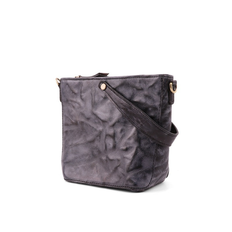 Gray textured crossbody bag on a white background